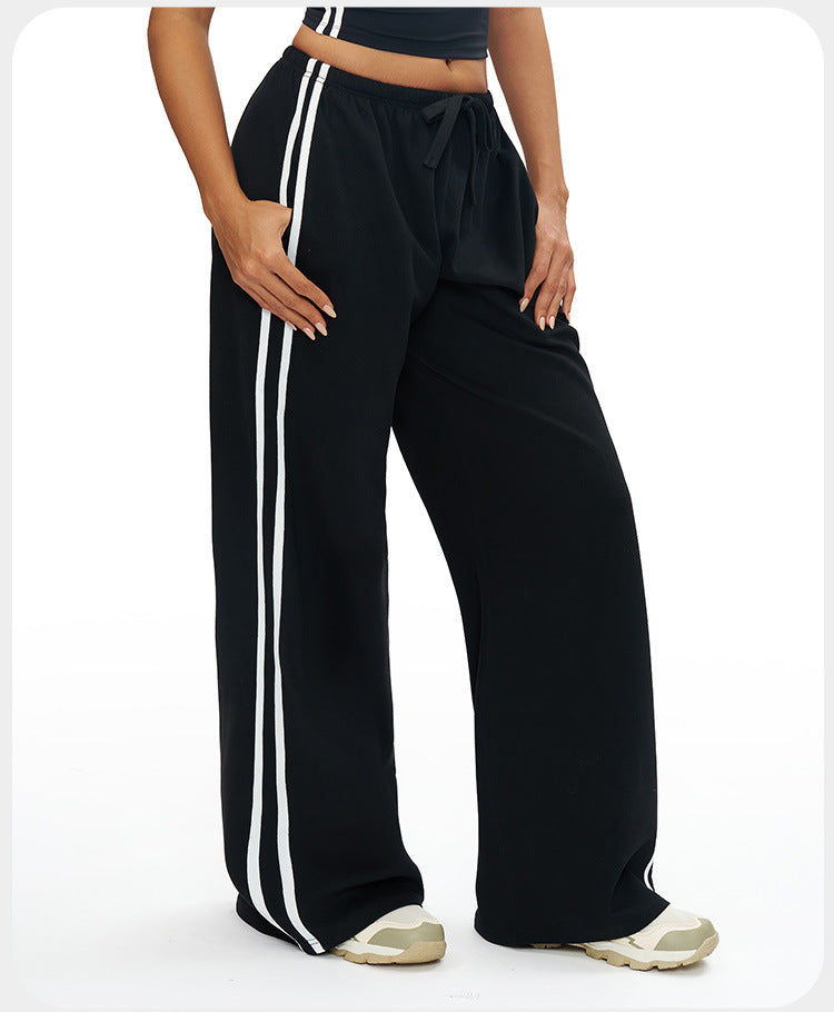 Day2Night Flare in Black – high-rise flare pants with side stripes and a wide flared leg – Hype Harmony