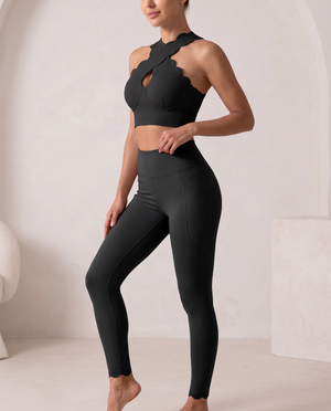 On The Go top in Black – wrap-front top with an open center and crossed lines – Hype Harmony