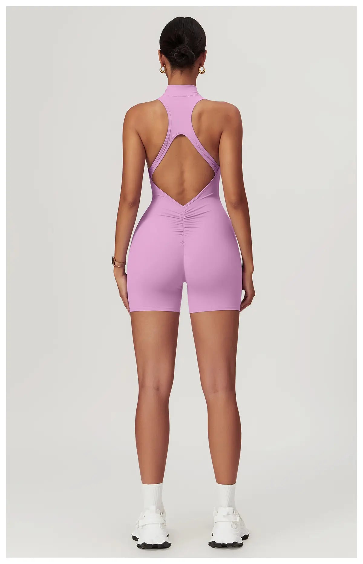 Weekend Jumpsuit in Powder Pink – high-neck jumpsuit with a front zip, short length, and crisscross back – Hype Harmony