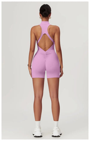 Weekend Jumpsuit in Powder Pink – high-neck jumpsuit with a front zip, short length, and crisscross back – Hype Harmony